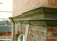 Sandstone cornice after repair, crisp architectural detailing Sandstone facade after repair